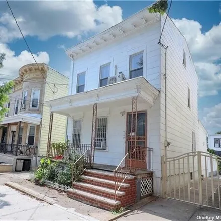 Buy this 5 bed house on 86-24 79th Street in New York, NY 11421