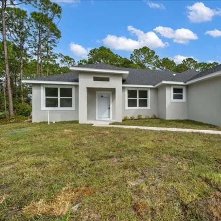 Buy this 4 bed house on 438 Tobias Street Southeast in Palm Bay, FL 32909