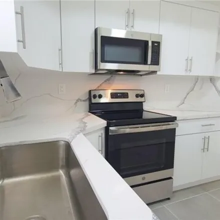 Rent this 3 bed condo on 17425 Northwest 75th Place in Palm Springs North, Miami-Dade County