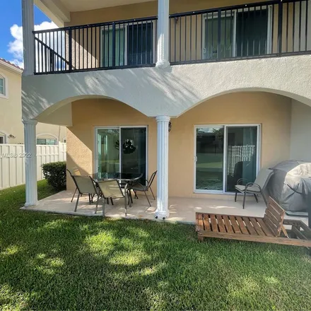 Rent this 4 bed apartment on 3417 Northwest 17th Terrace in Royal Palm Isles, Broward County