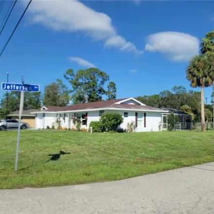 Rent this 3 bed house on 211 Jefferson Avenue in Lehigh Acres, FL 33936