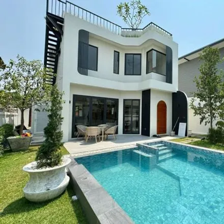 Rent this 5 bed house on Food Stall (night) in Charoen Muang Road, QHouse Villa