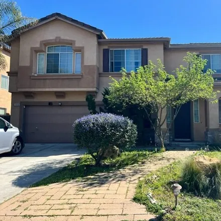 Buy this 4 bed house on 1125 Whispering Wind Drive in Tracy, CA 95377