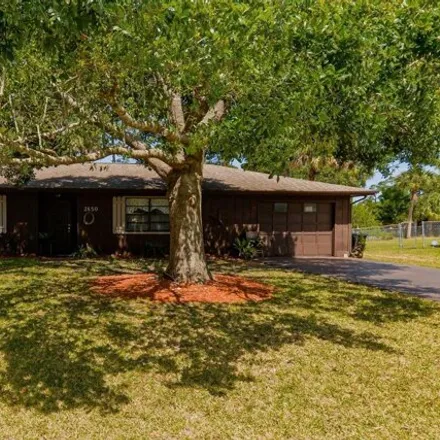Buy this 3 bed house on 2646 Southwest Ace Road in Port Saint Lucie, FL 34953