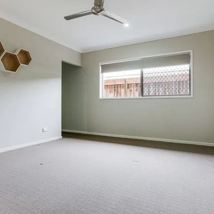 Rent this 4 bed apartment on 16 Hershey Close in Yarrabilba QLD 4207, Australia