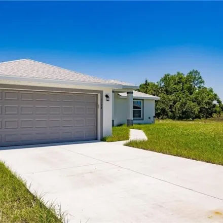 Rent this 3 bed house on 1131 Cecelia Avenue in Lehigh Acres, FL 33971