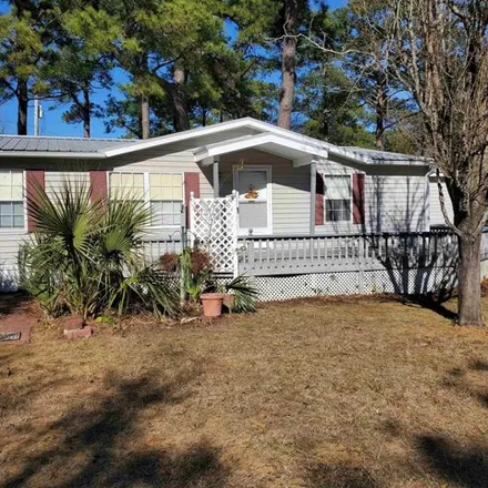 Buy this studio apartment on 498 Delton Drive in Garden City Beach, Horry County