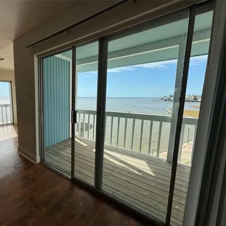 Rent this 2 bed condo on Tiki Drive in Tiki Island, Galveston County