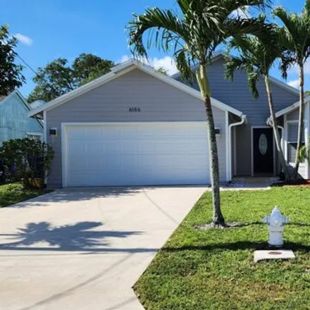 Rent this 4 bed house on 15201 Marrian Avenue in North Palm Beach Heights, Jupiter