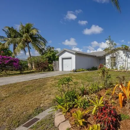 Buy this 4 bed house on 1507 Sw 4th Ter in Deerfield Beach, Florida