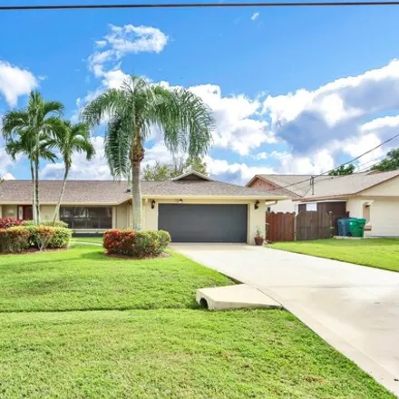 Rent this 3 bed house on 324 Northeast Surfside Avenue in Port Saint Lucie, FL 34983