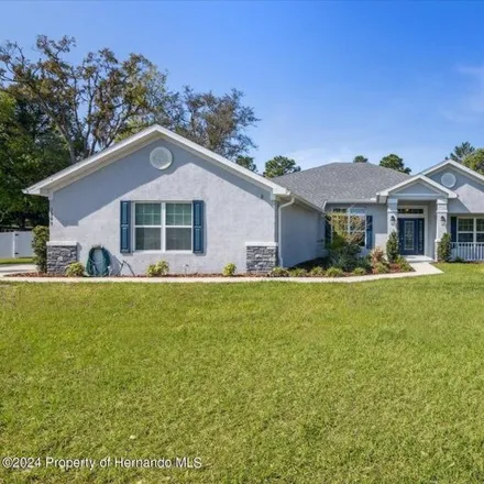 Buy this 4 bed house on 3309 Ponytail Court in Spring Hill, FL 34609
