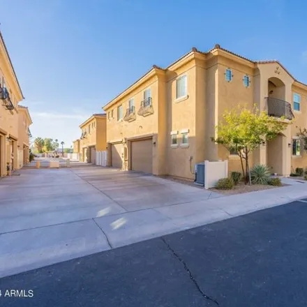 Rent this 4 bed townhouse on South Diamonte Road in Mesa, AZ 85210