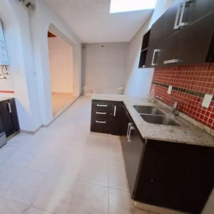 Buy this 4 bed house on Cura Renque 1653 in Monte Castro, C1407 GPB Buenos Aires