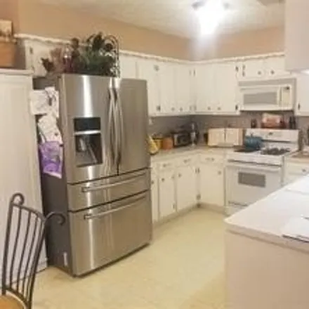 Rent this 3 bed house on 2101 Woody Road in Pearland, TX 77581