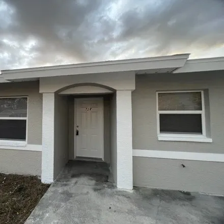 Rent this 3 bed house on 726 Holmes Avenue in Lehigh Acres, FL 33974
