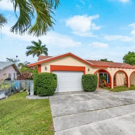 Buy this 4 bed house on 2841 Hypoluxo Rd Unit 2841 in Lake Worth, Florida