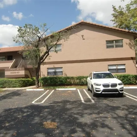 Rent this 2 bed condo on 10569 Royal Palm Boulevard in Coral Springs, FL 33065