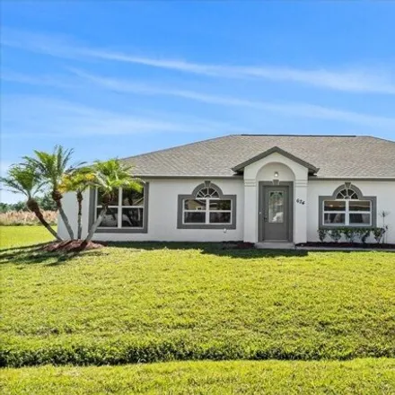 Buy this 4 bed house on 636 Heraldo Court in Poinciana, FL 34758