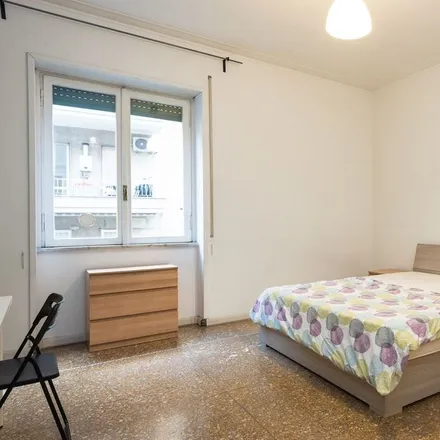Rent this 6 bed room on Via Oreste Tommasini