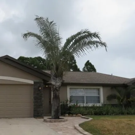 Rent this 3 bed house on 2329 Mantilla Avenue Southeast in Palm Bay, FL 32909