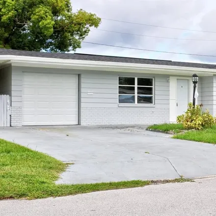 Rent this 3 bed house on 3614 Latimer Street in Elfers, FL 34652