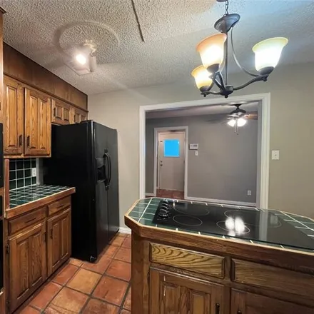 Rent this 3 bed house on 5062 Millsprings Drive in Arlington, TX 76017
