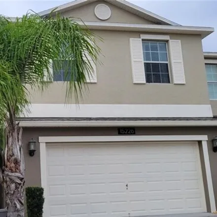 Rent this 3 bed townhouse on 15230 Pacey Cove Drive in Meadow Woods, Orange County