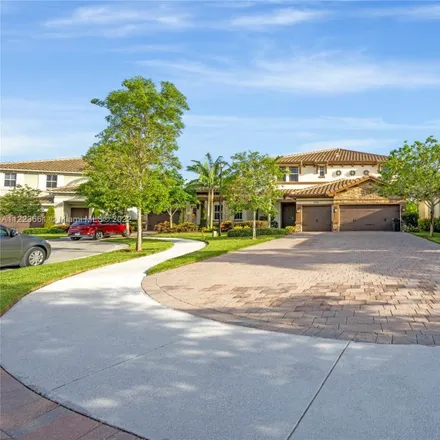 Buy this 5 bed house on 9726 Blue Isle Bay in Parkland, FL 33076