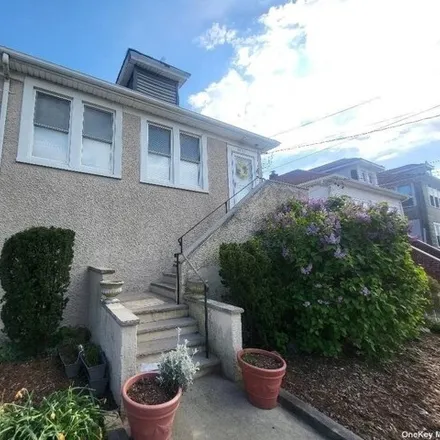 Buy this 6 bed house on 69-35 Hessler Avenue in New York, NY 11692