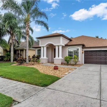 Buy this 4 bed house on 3613 Hickory Hammock Loop in Wesley Chapel, Florida