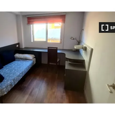 Rent this 3 bed room on Carrer Carretera de Llíria in 46100 Burjassot, Spain