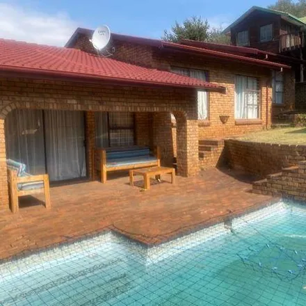 Rent this 4 bed apartment on Comaro Street in Bassonia, Johannesburg