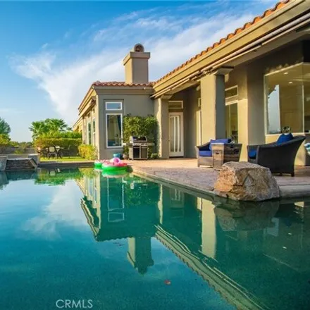 Buy this 4 bed house on Greg Norman Course Resort Course (PGA West) in Four Seasons Place, La Quinta