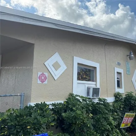 Buy this 13 bed house on 3086 Northwest 2nd Street in Collier Park, Pompano Beach