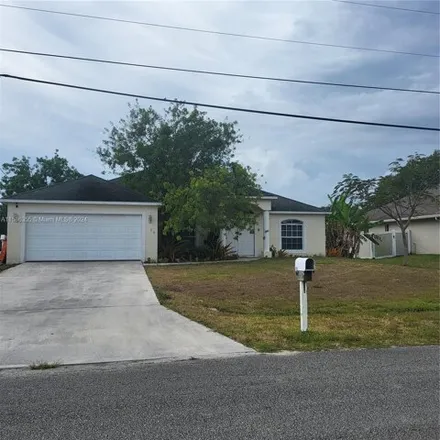 Rent this 4 bed house on 330 Southwest Lacroix Avenue in Port Saint Lucie, FL 34953