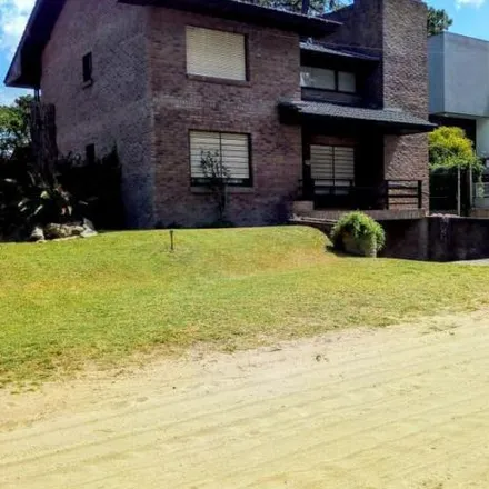 Buy this 3 bed house on Paseo 110 in Partido de Villa Gesell, Villa Gesell