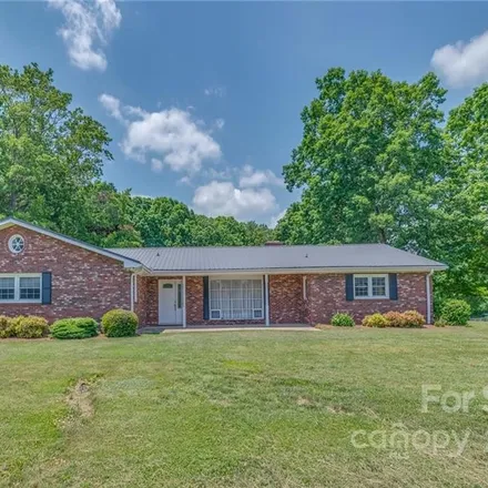 Buy this 4 bed house on 1700 Howard Gap Road in Henderson County, NC 28792