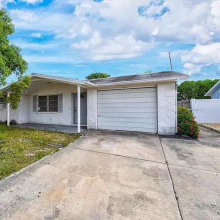 Buy this 2 bed house on 3422 Eisenhower Drive in Holiday, FL 34691