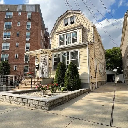 Buy this 6 bed townhouse on 89-01 69th Avenue in New York, NY 11375
