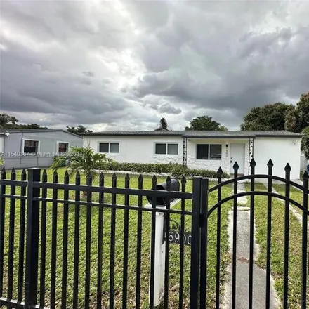 Rent this 4 bed house on 6900 Northwest 28th Avenue in Palm Lake Trailer Court, Miami-Dade County