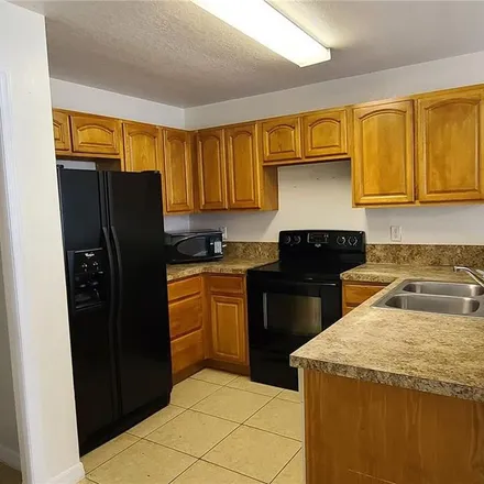 Rent this 4 bed apartment on 772 Camel Court in Polk County, FL 34759