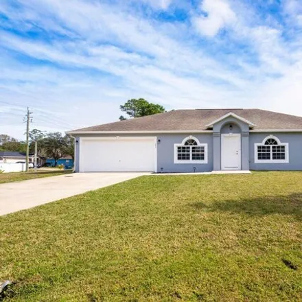 Buy this 4 bed house on 1204 Wyoming Drive Southeast in Palm Bay, FL 32909
