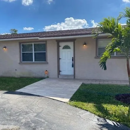 Rent this 3 bed house on 1900 Carambola Road in Lake Clarke Shores, Palm Beach County