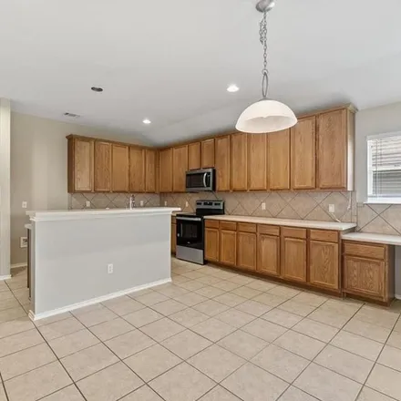 Rent this 4 bed apartment on 705 Timothy John Drive in Pflugerville, TX 78664