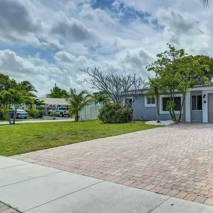 Buy this 3 bed house on 299 Northeast 42nd Court in North Andrew Gardens, Broward County