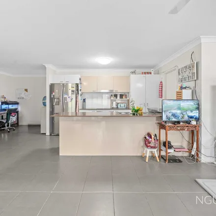 Rent this 4 bed apartment on Diamantina Boulevard in Brassall QLD 4305, Australia