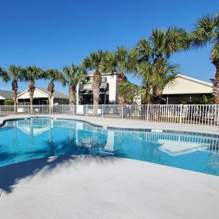 Rent this 3 bed townhouse on 121 Seagrass Way in Panama City Beach, FL 32407