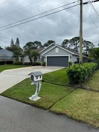 Buy this 3 bed house on 1834 Southwest Buttercup Avenue in Port Saint Lucie, FL 34953