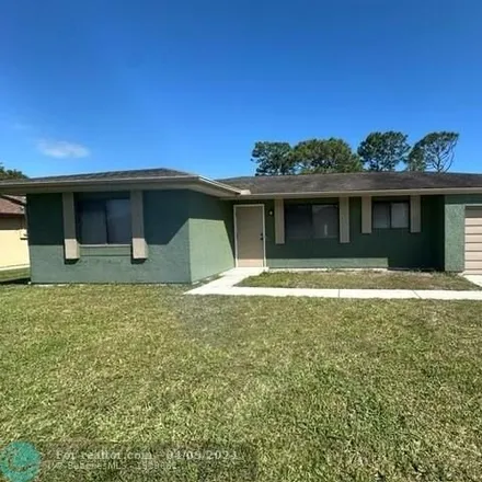 Buy this 2 bed house on 2563 Southeast Dogwood Avenue in Port Saint Lucie, FL 34952